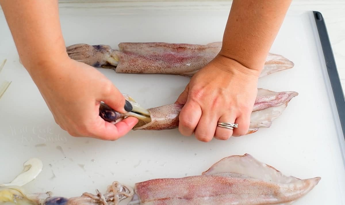 pulling off the head and tentacles off the squid body