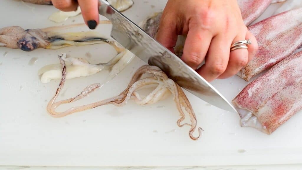 cutting off the tentacles of the squid