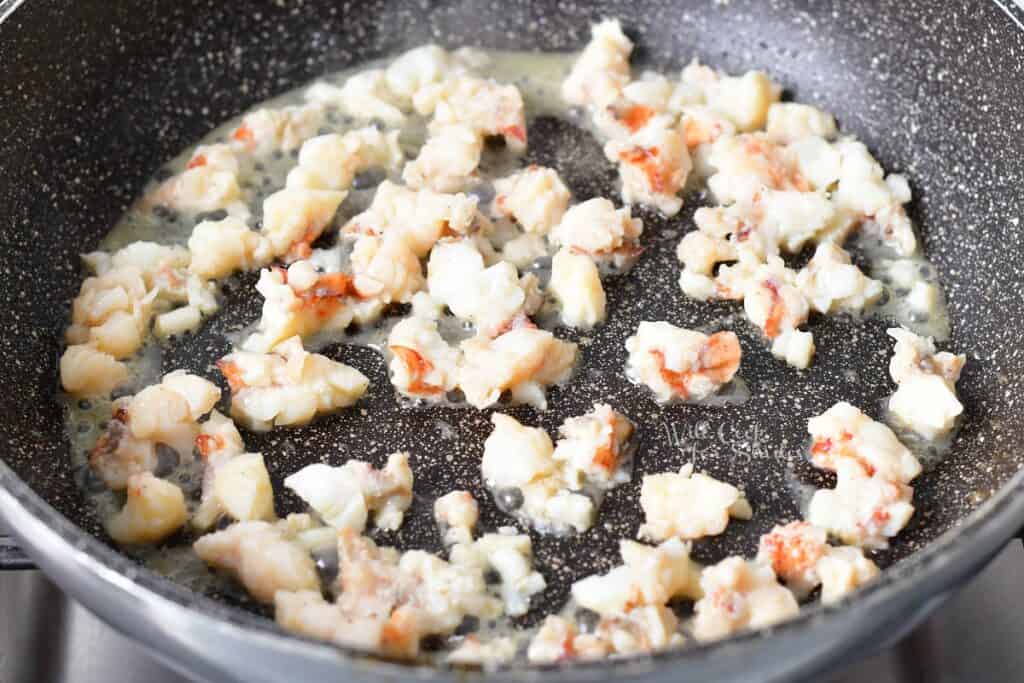 lobster meat cooking in the pan