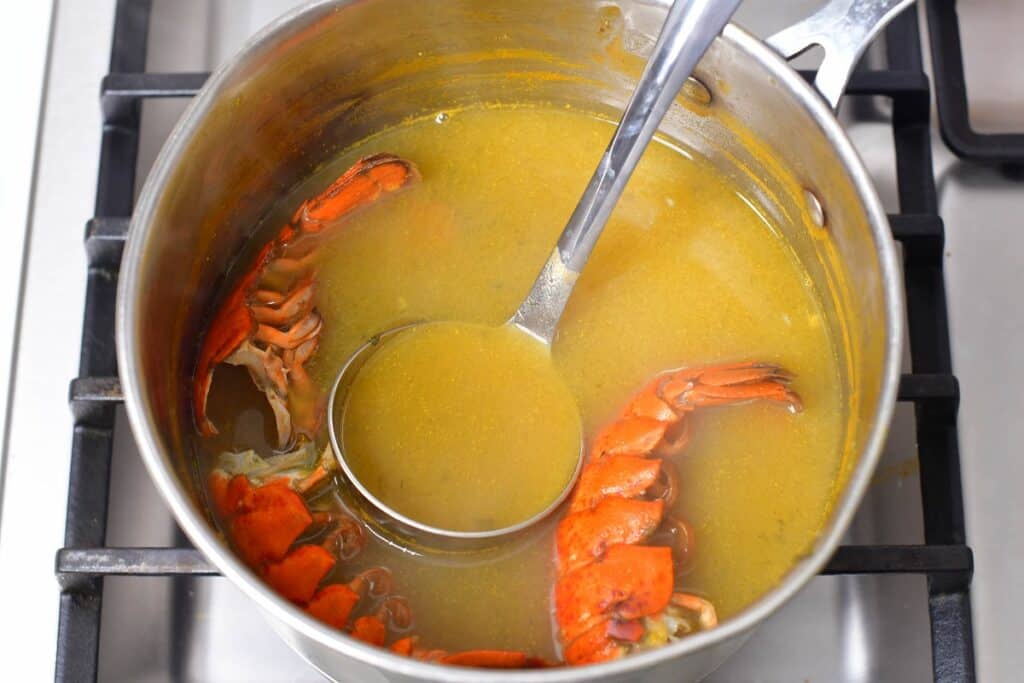 broth with lobster shells in the pot