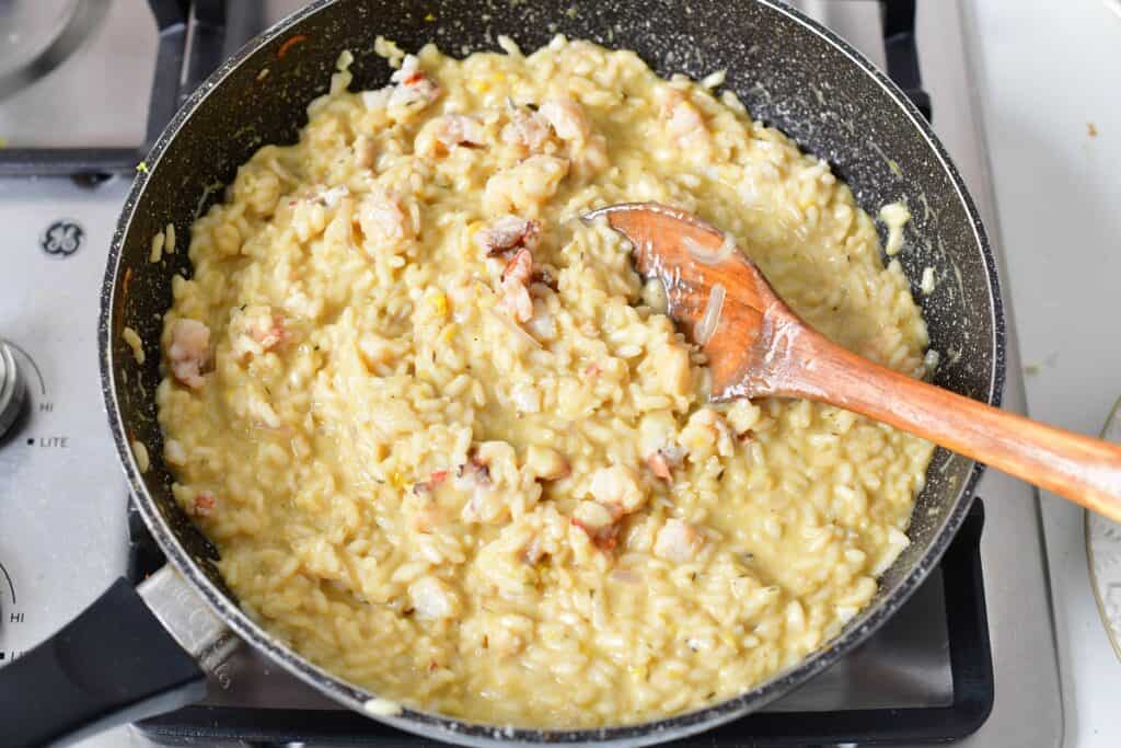 stirring lobster meat into the risotto