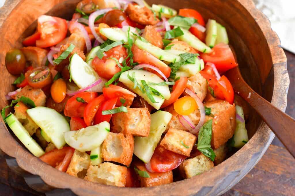 closeup view of panzanella in a wooden bowl