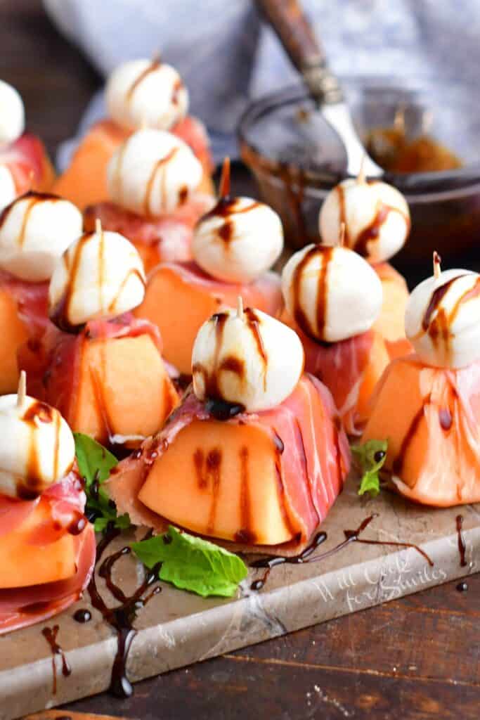 closeup of prosciutto wrapped melon appetizer