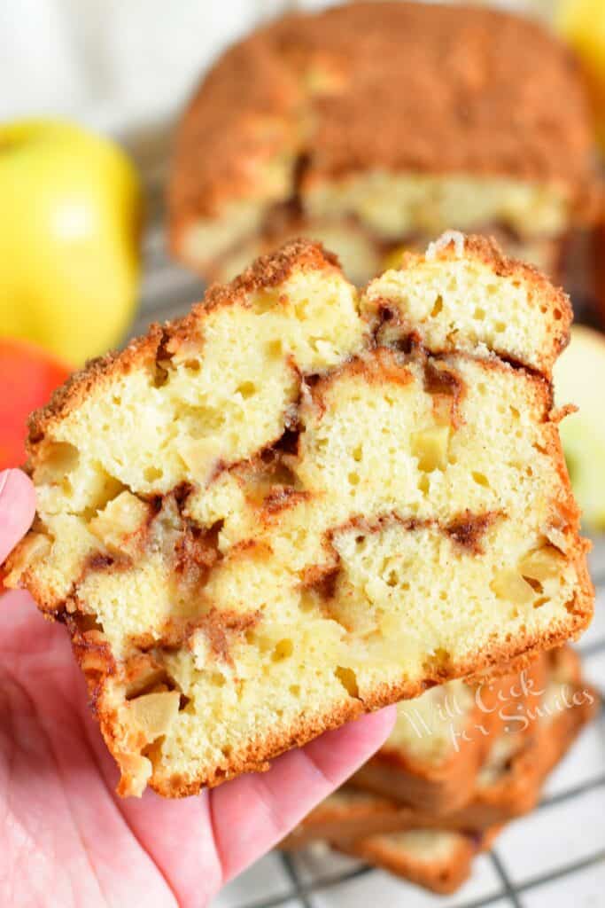 A slice of bread is being held by a hand.