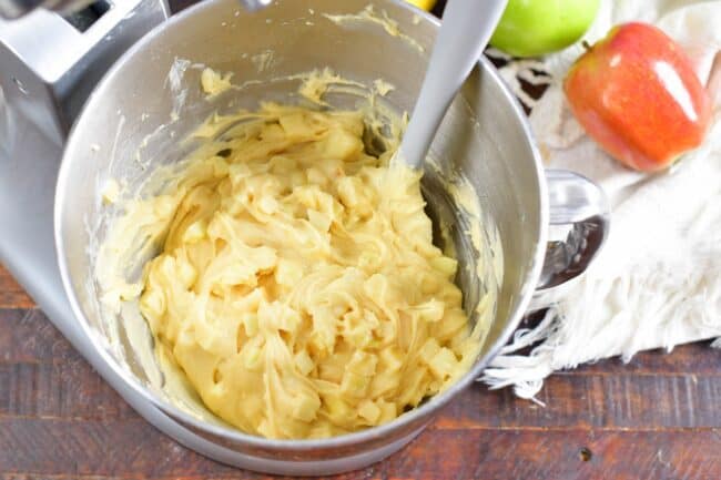 Apples have been stirred into the batter. 