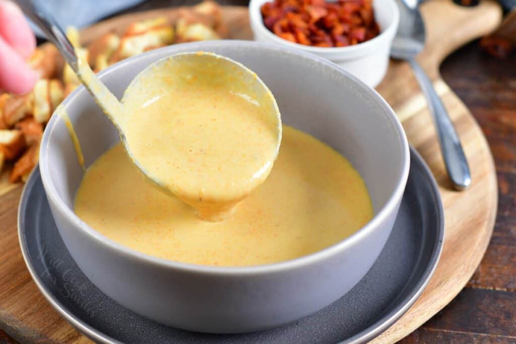 pouring soup into the bowl