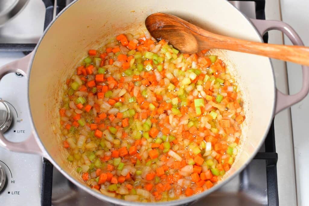 Veggies are being cooked in the rendered bacon fat.