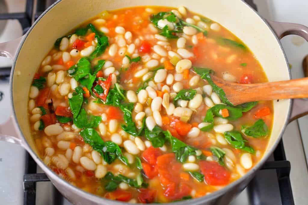 Ingredients have been stirred in a large pot.