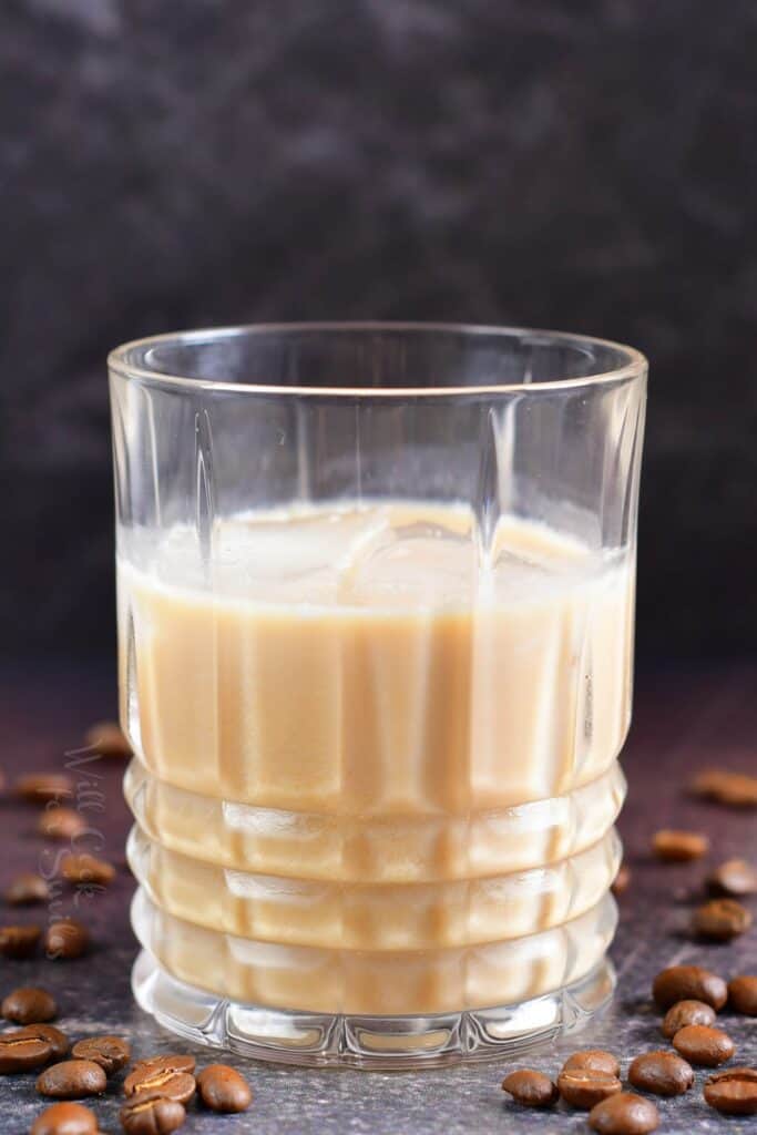 close up of creamy light brown White Russian cocktail in a glass