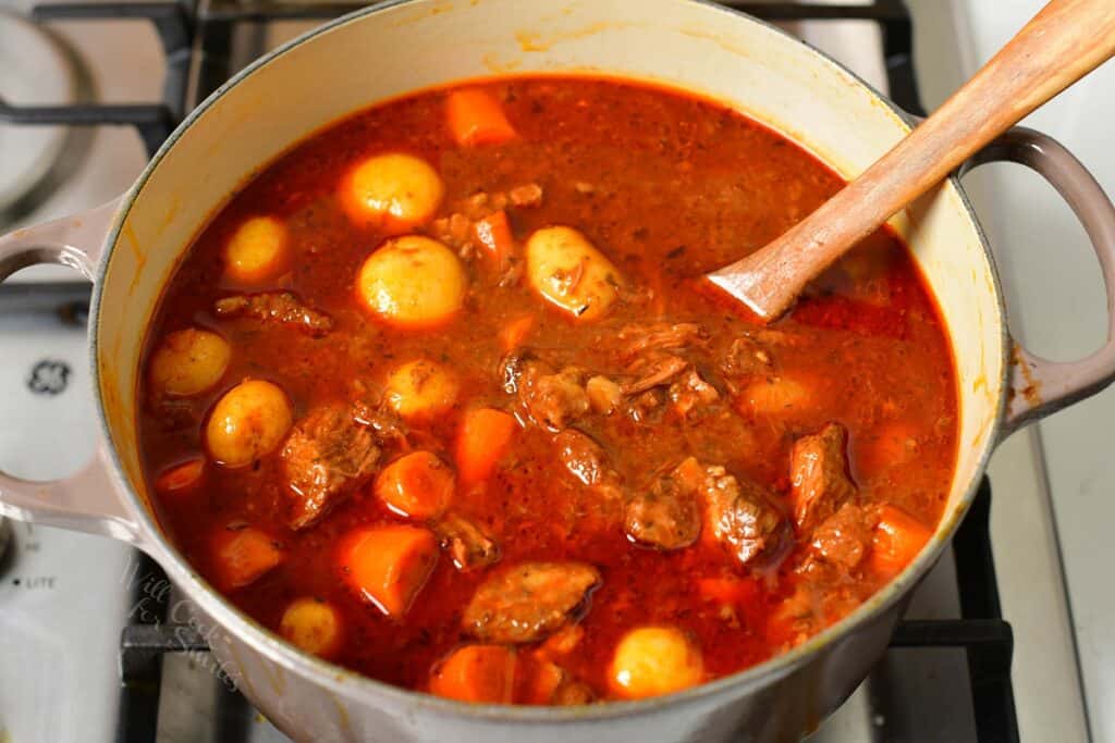 cooked beef stew in a pot on a stove