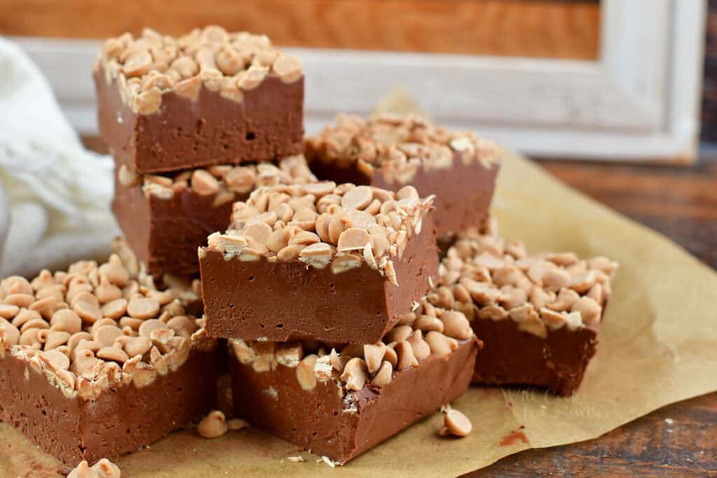 horizontal image of stacked peanut butter fudge on parchment