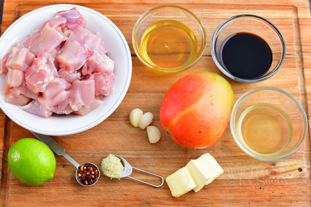 ingredients for the mango chicken on a cutting board