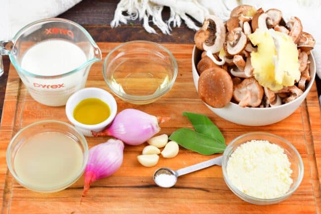 ingredients for the mushroom sauce on a cutting board