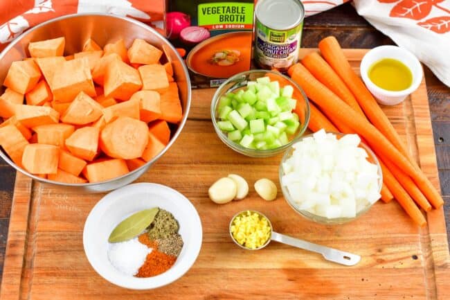 ingredients for sweet potato soup on a cutting boarc