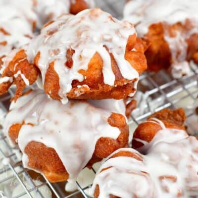 stacked apple fritters on the wire rack