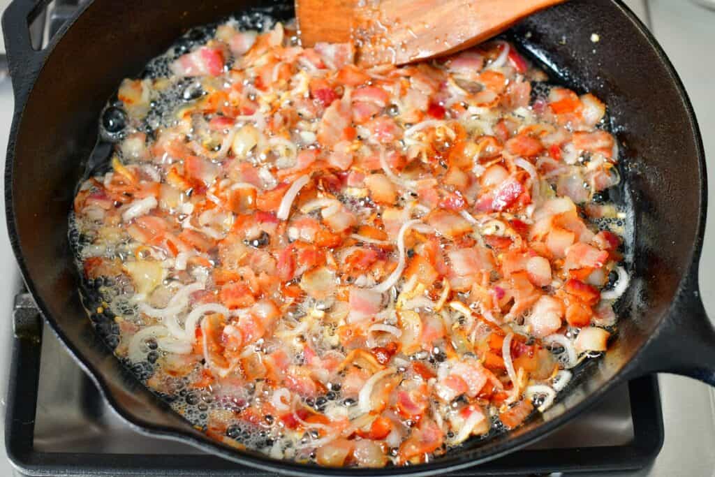 sautéing shallots and bacon in a skillet