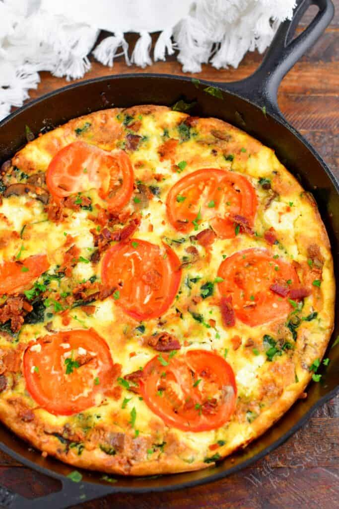 top view of a whole frittata in a cast iron skillet