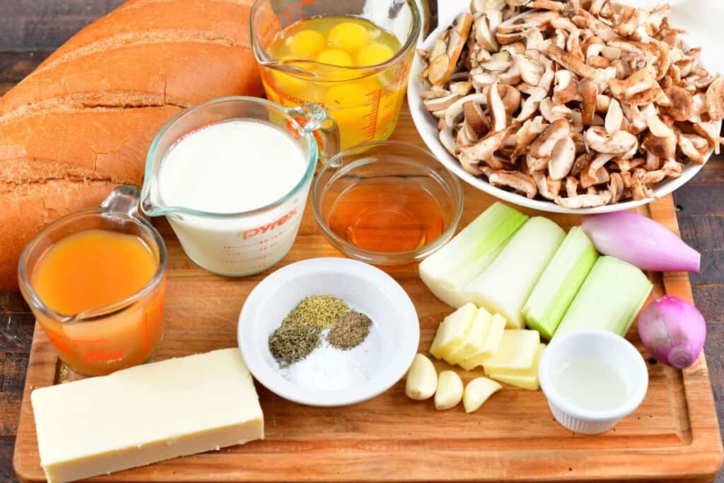 ingredients for mushroom bread pudding on a board