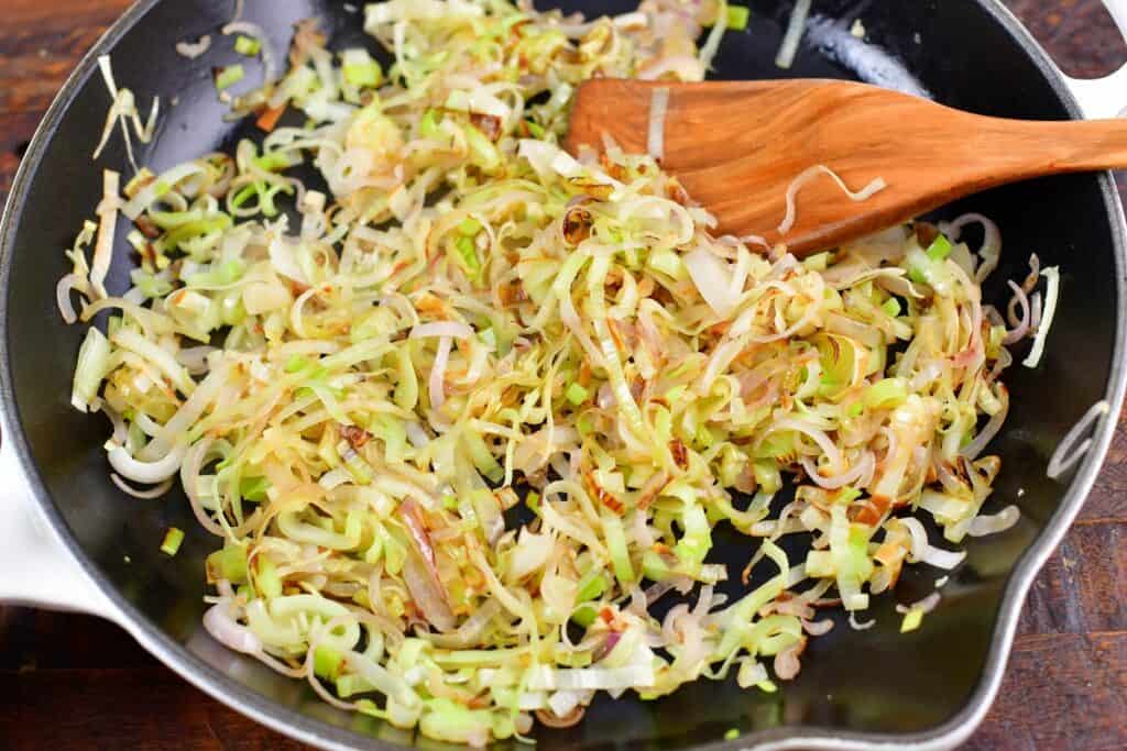 sautéed leeks and shallots in a pan