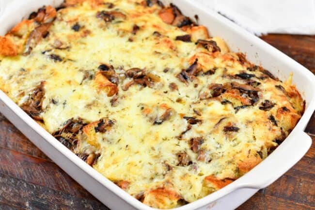 baked mushroom bread pudding in a white dish