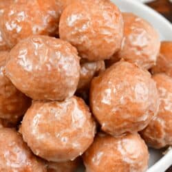 top view of the iced pumpkin doughnuts on a plate