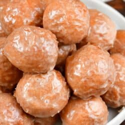 top view of the iced pumpkin doughnuts on a plate