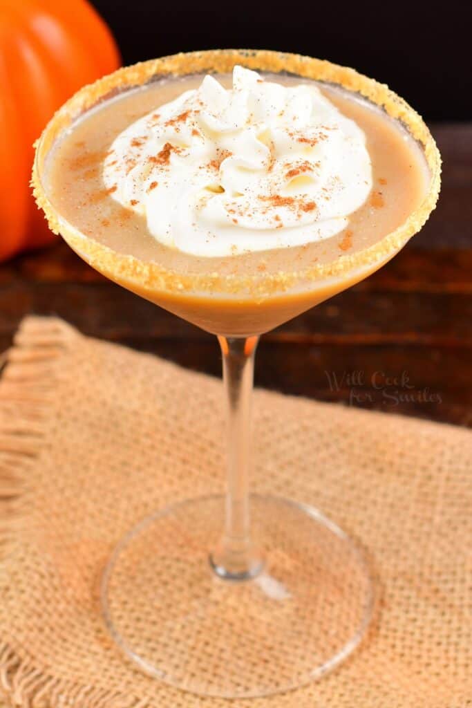 top view of a pumpkin martini in a glass with whipped cream
