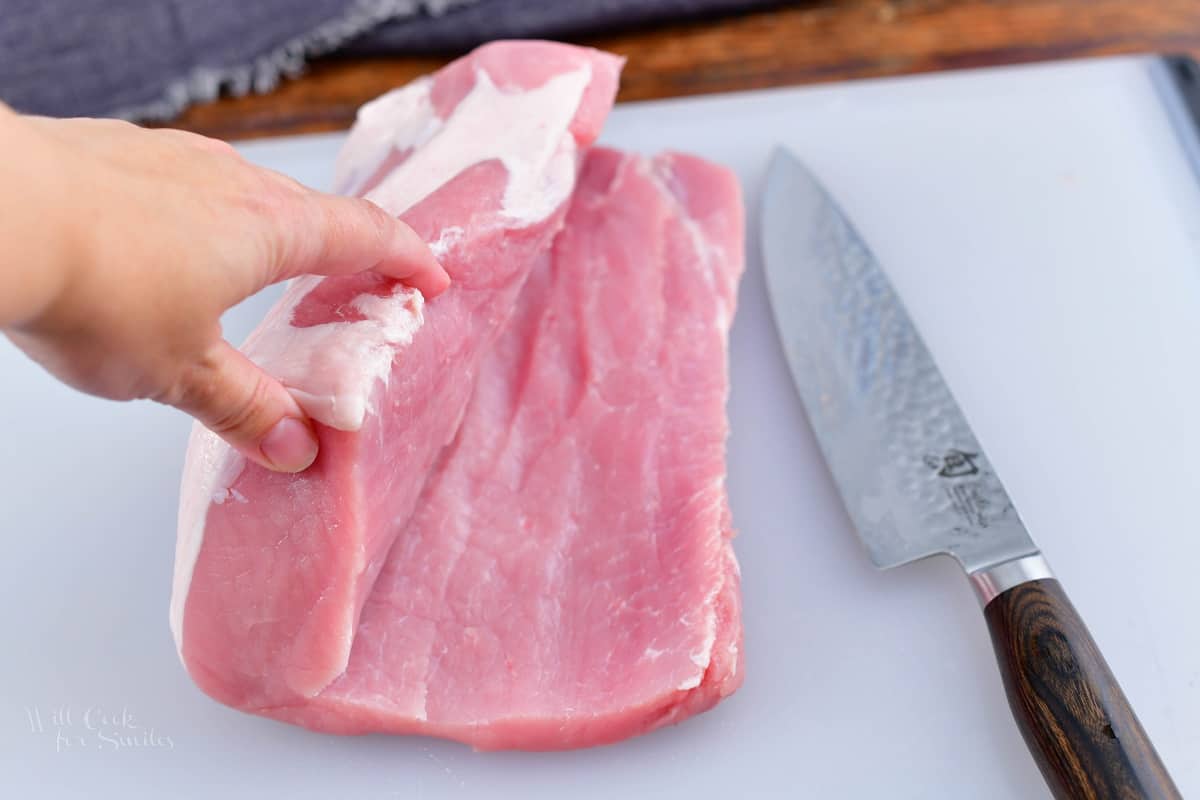 cutting open the pork loin