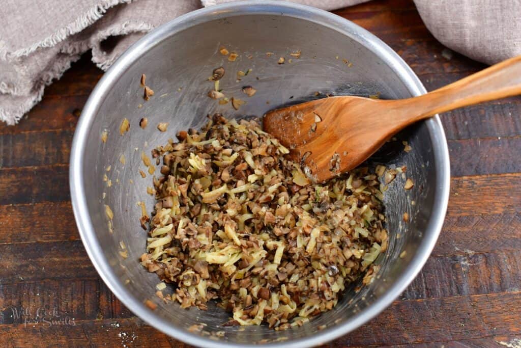 mushroom and cheese filling in a mixing bowl