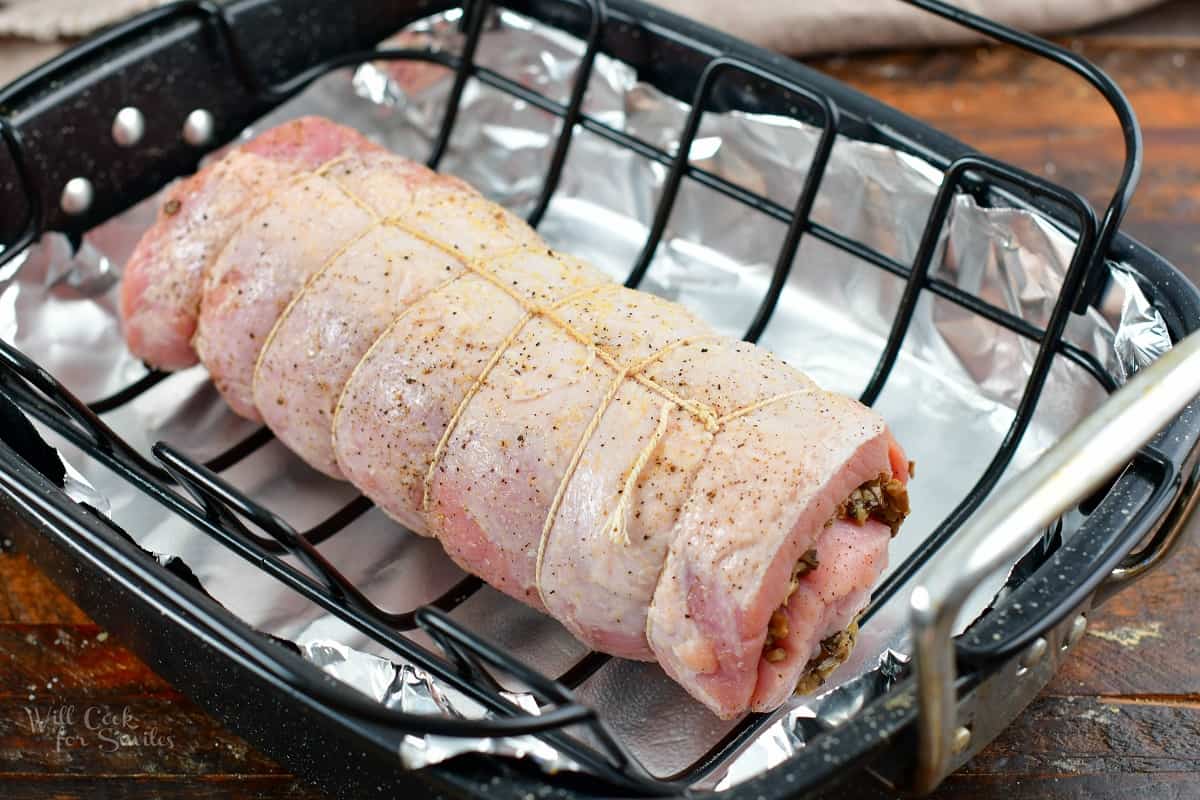 ties and stuffed pork loin on a roasting pan