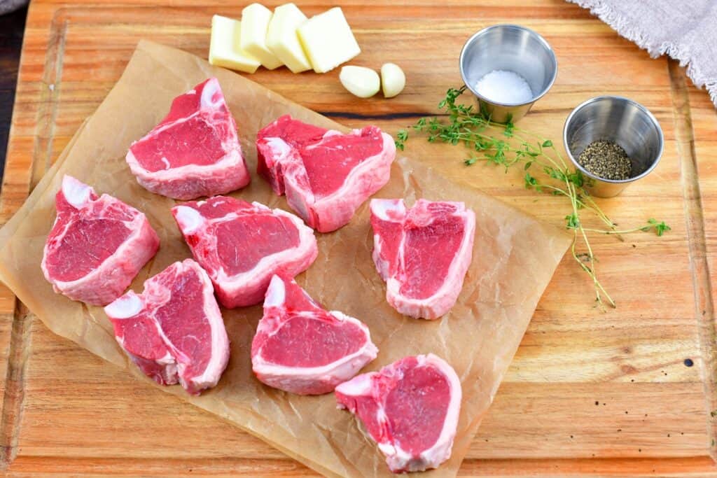 ingredients for lamb chops on a cutting board