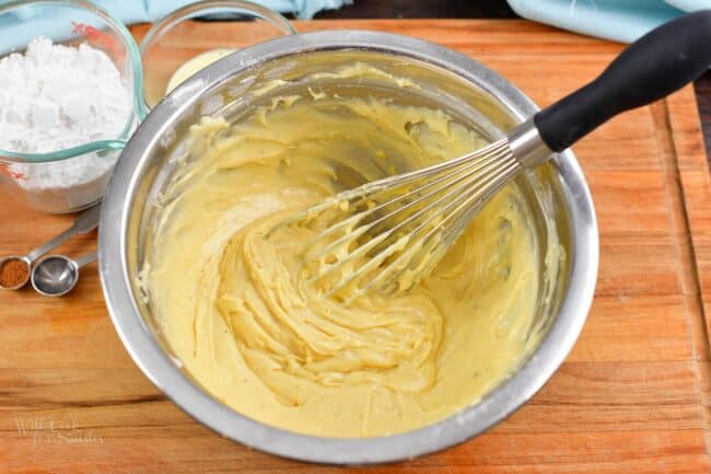 whisked batter and a whisk inside the mixing bowl