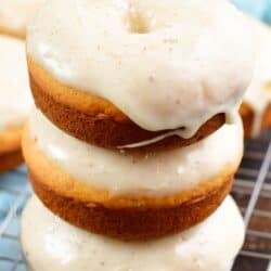 stacked glazed donuts on a wire rack