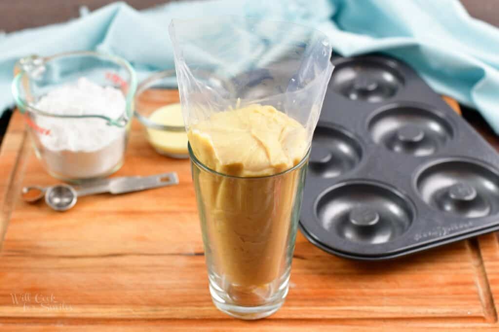 batter inside the piping bag inside the pint glass