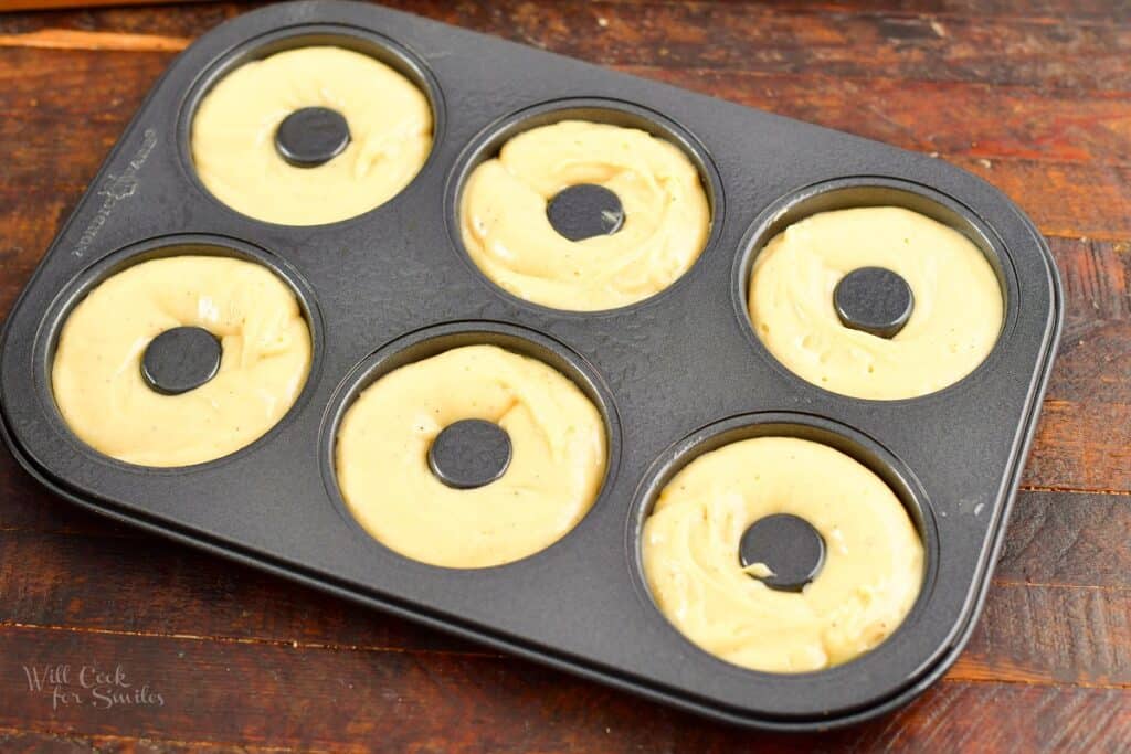 doughnut batter in the doughnut baking pan