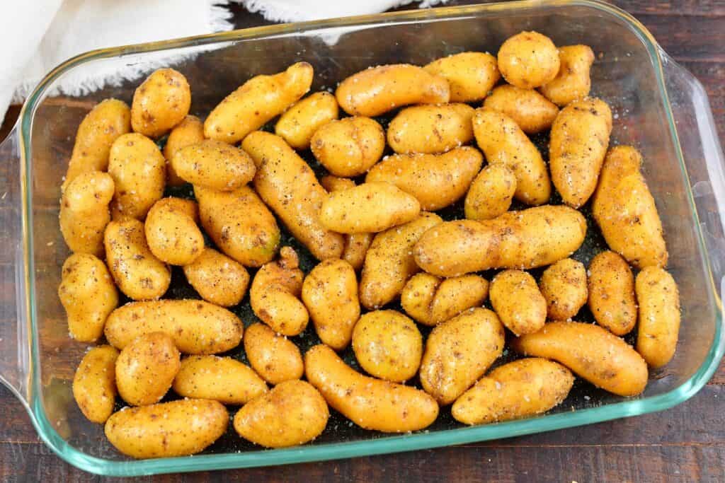 seasoned fingerling potatoes in a glass baking dish