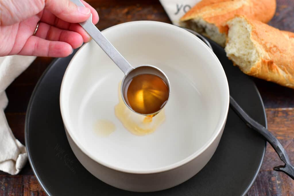 pouring sherry into the soup bowl