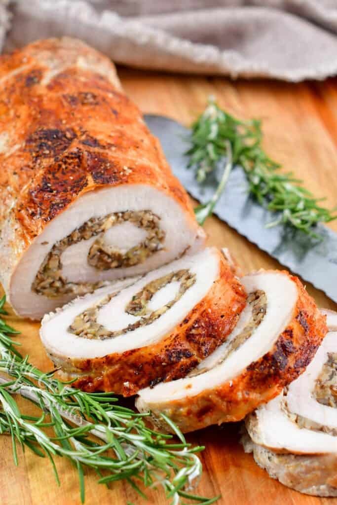 stuffed pork loin sliced and rosemary around