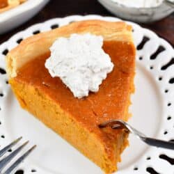 fork going through a slice of sweet potato pie