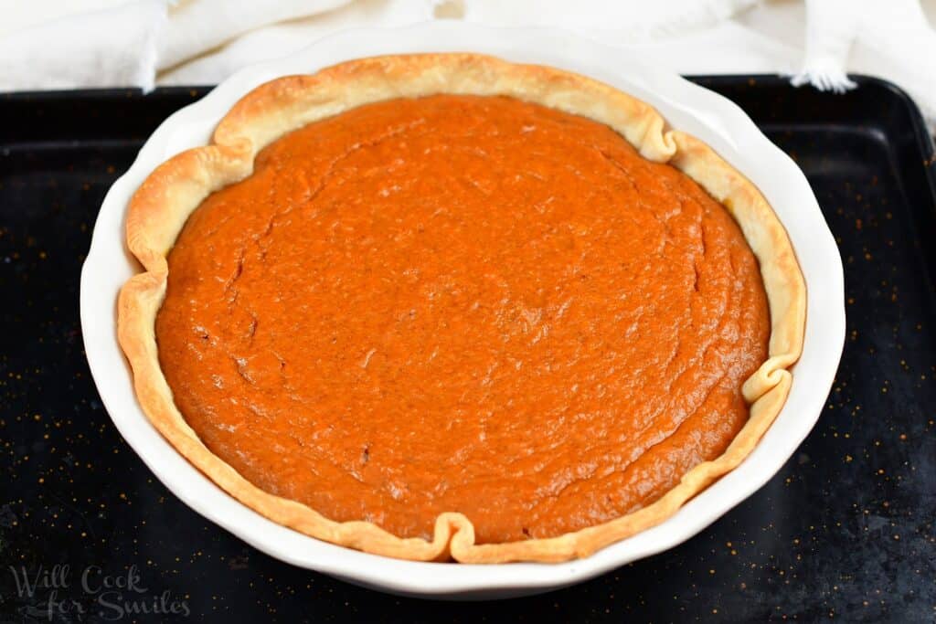 baked sweet potato pie on a baking sheet