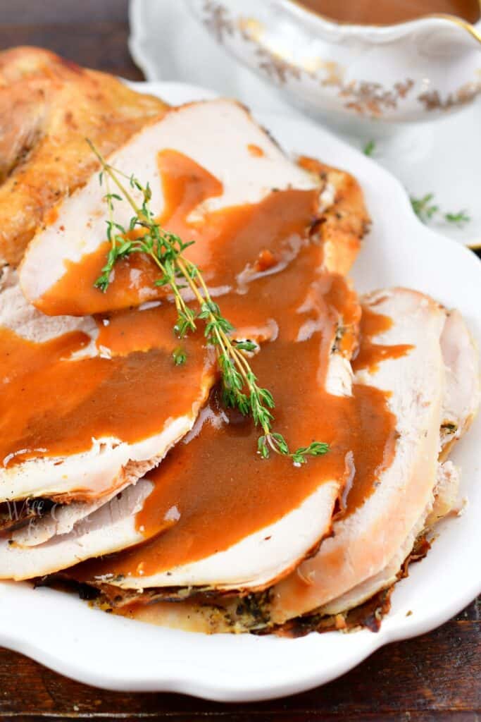 closeup of sliced turkey breast and gravy