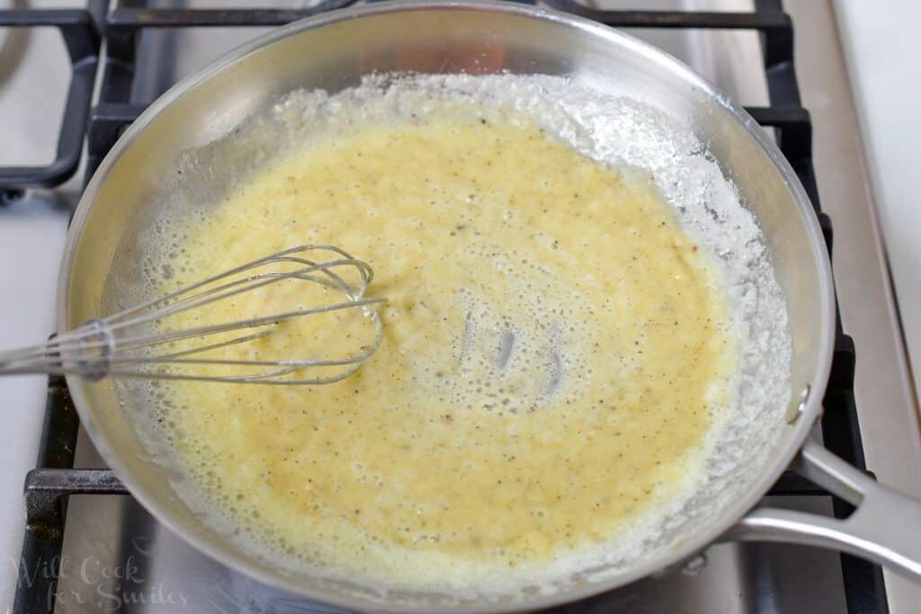 whisking flour into melted butter in a pan