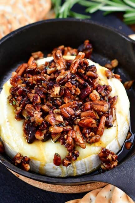 top view of baked brie topped with honey and pecans