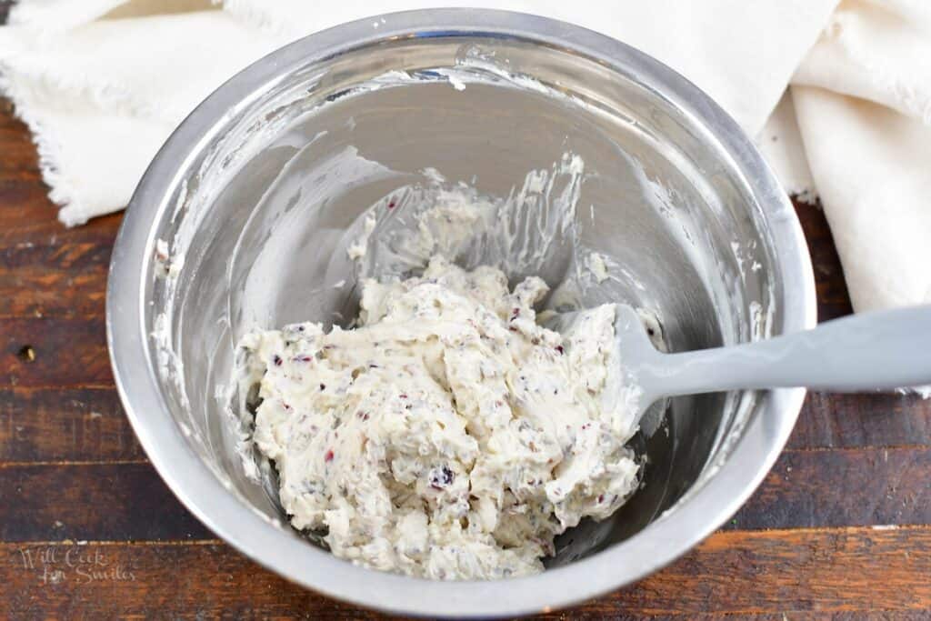 cream cheese mixture in a mixing bowl with a spatula