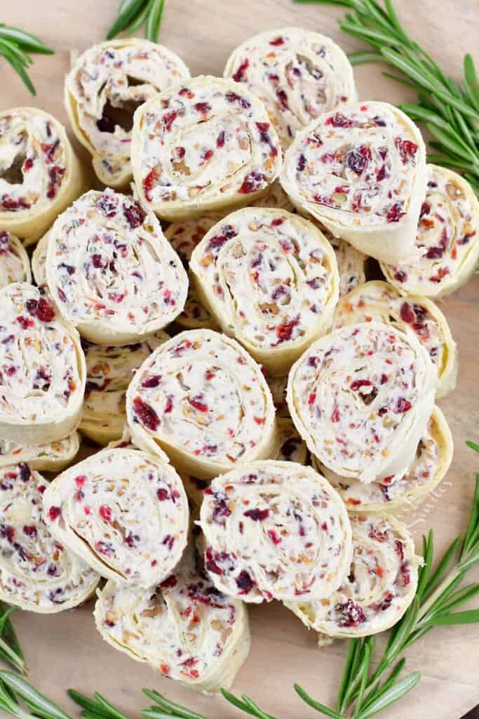 top view of stacked cranberry pinwheels with rosemary around