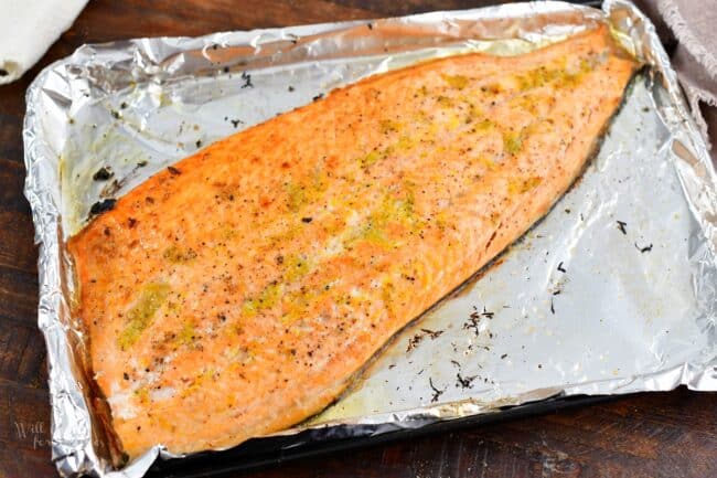 whole salmon baked on the baking sheet