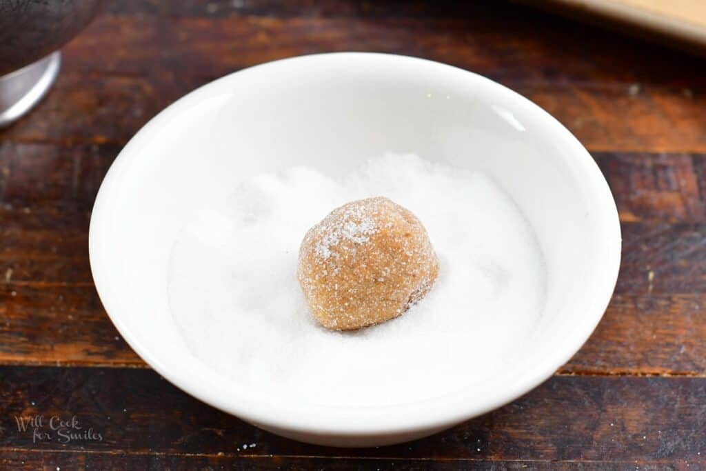 ball of cookie dough in sugar bowl