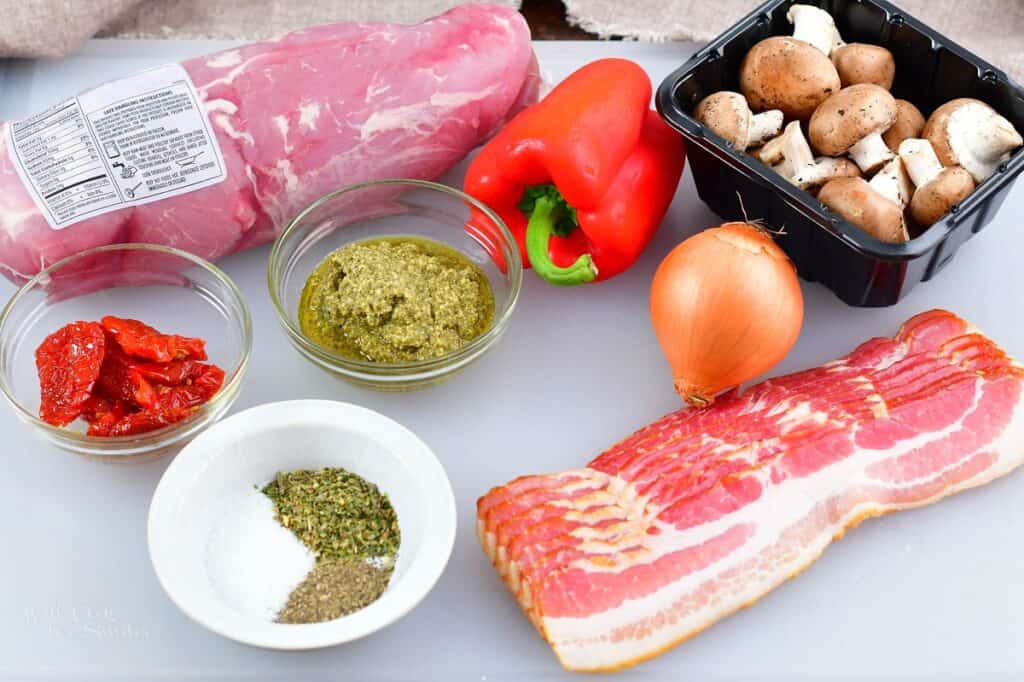 ingredients for stuffed pork tenderloin on the cutting board