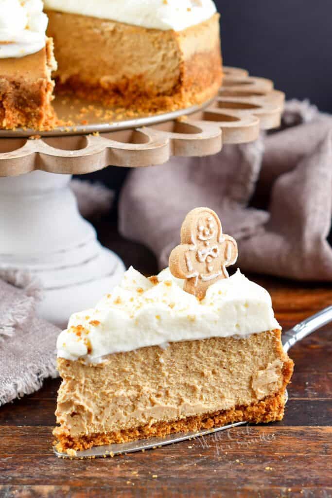 slice of gingerbread cheesecake next to the cake stand