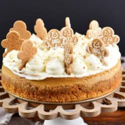 side view of the gingerbread cheesecake on a cake stand